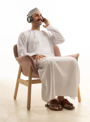 Saudi Man with Headphones Sitting in Studio