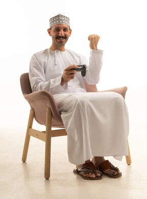 Arab Man Playing Video Games on White Background