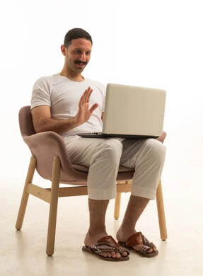 Saudi Man on Laptop Video Call White Background