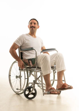 Saudi Man in Wheelchair on White Background