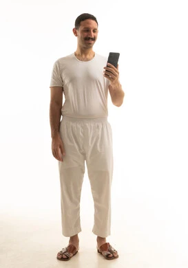Saudi Man in White Clothes Using Smartphone