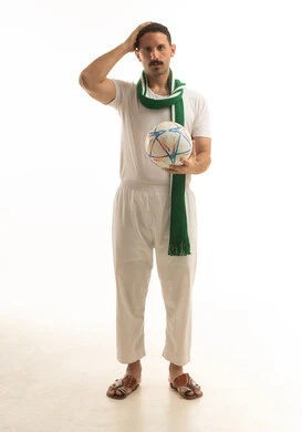 Disappointed Saudi Fan with Football and Green Scarf