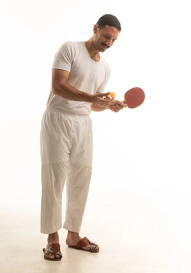 Saudi Man Playing Table Tennis on White Background