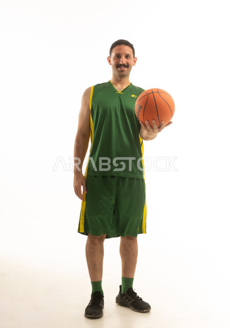 Saudi Basketball Player in Green Uniform on White