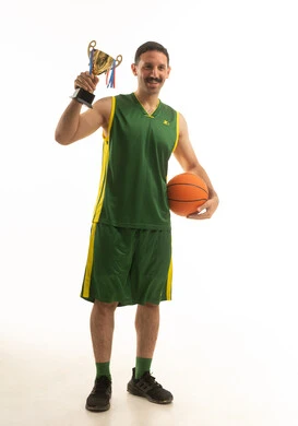 Saudi Basketball Player Holding Gold Trophy and Ball