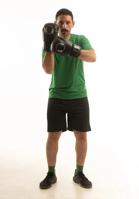 Saudi Man in Boxing Stance with Studio Background