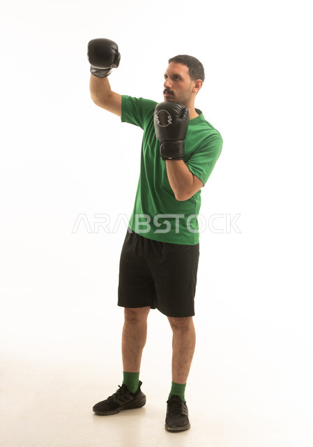 Saudi Man Boxing in Green Shirt on White Background