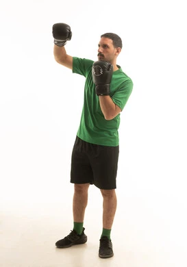 Saudi Man Boxing in Green Shirt on White Background