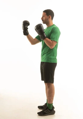Saudi Man in Boxing Pose with Black Gloves