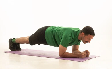 Saudi Man Doing Plank Exercise on White Background