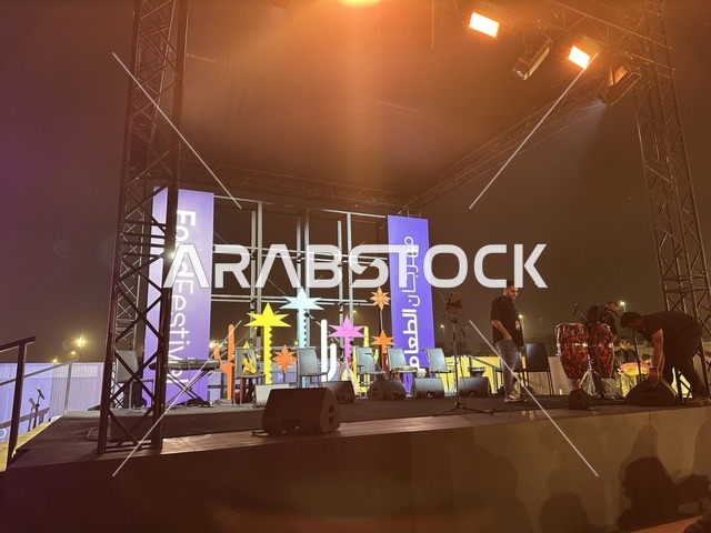 A musical performance with folkloric costumes and drumming at a food festival in the outdoor Ithra Gardens in Dhahran, Eastern Province, Saudi Arabia, on December 28, 2025. Family-friendly and entertaining atmosphere, a recreational and educational experience, international and local restaurants, enjoyable outdoor seating.