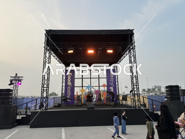 Enjoyable outdoor sessions, a musical performance at a food festival in the outdoor gardens of Ithra in Dhahran, Eastern Province, Saudi Arabia, on December 28, 2025. Family-friendly and entertaining atmosphere, an entertaining and educational experience, international and local restaurants.