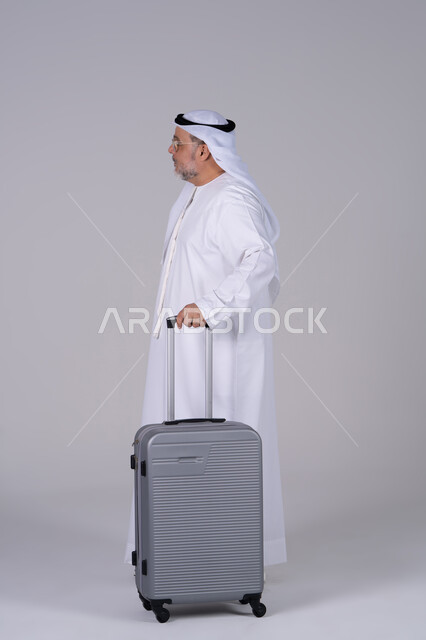 Emirati Man with Suitcase Full Length Studio Shot