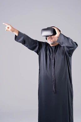Emirati Man in Black Kandura Using VR Headset