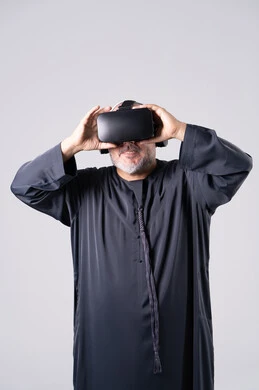 Emirati Man Using Virtual Reality Headset in Studio
