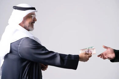 Emirati Man Handing Money on White Background