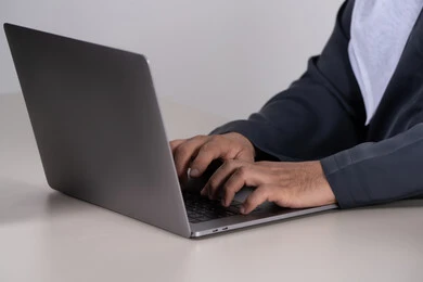 Emirati Man Typing on Laptop Close Up