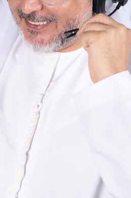Emirati Man with Headset Close-up Professional Office Emirati Man with Headset Close-up Professional Office