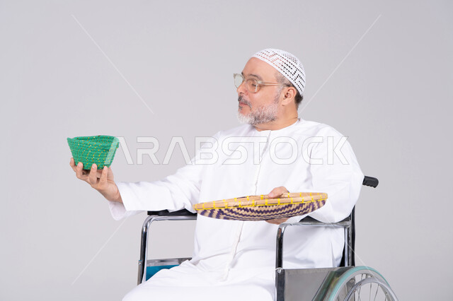 Emirati Man in Wheelchair with Traditional Wicker Baskets