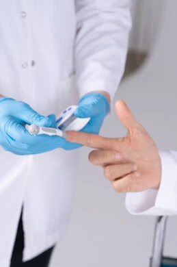 Emirati Doctor Performing Blood Glucose Test Close-up