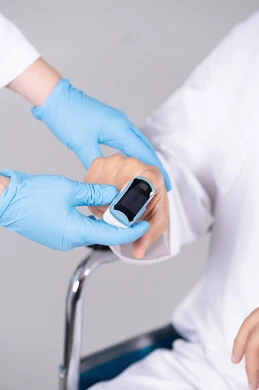 Pulse Oximeter Check on Emirati Patient in Wheelchair