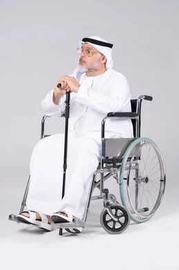 Senior Emirati Man in Wheelchair on White Background