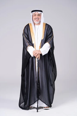 Senior Emirati Man in Traditional Black Bisht