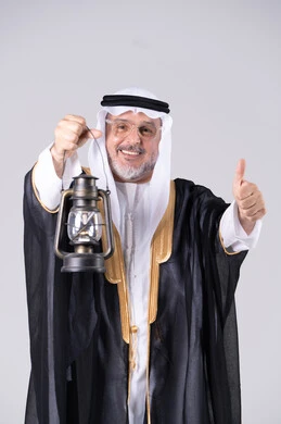Emirati Man in Traditional Bisht Holding Lantern