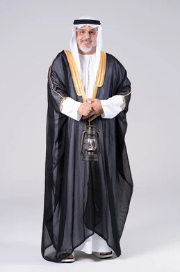 Emirati Man in Traditional Bisht Holding Lantern