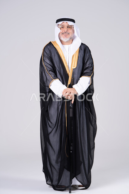 Emirati Man in Traditional Black Bisht on White Background