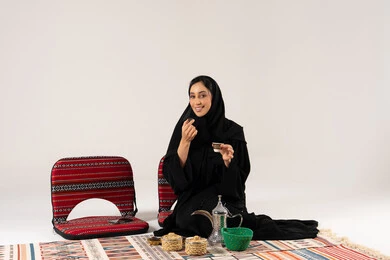 Saudi Woman with Arabic Coffee and Dates