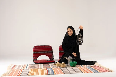 Saudi Woman with Traditional Lantern and Dallah