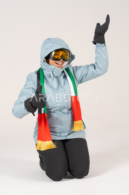 Emirati Woman in Ski Gear with UAE Flag Scarf