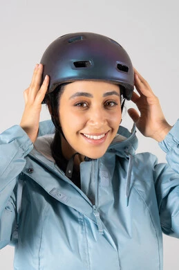 Smiling Arab Woman Wearing Bicycle Helmet in Studio