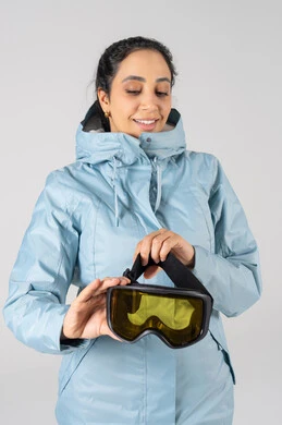 Arab Woman in Winter Parka Holding Ski Goggles Arab Woman in Winter Parka Holding Ski Goggles