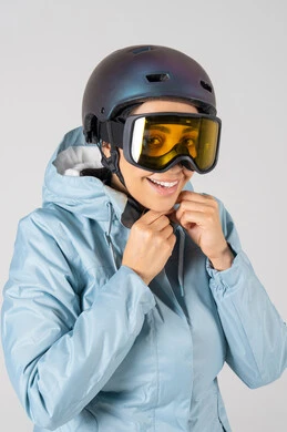 Smiling Middle Eastern Woman in Ski Gear and Helmet Smiling Middle Eastern Woman in Ski Gear and Helmet