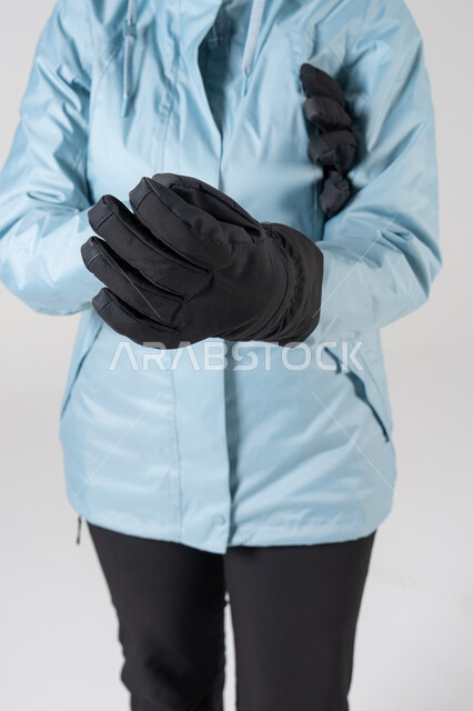 Blue Winter Jacket and Black Snow Gloves Studio Shot