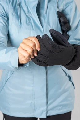 Person Wearing Blue Winter Jacket and Black Gloves Person Wearing Blue Winter Jacket and Black Gloves