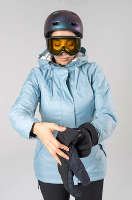 Saudi Woman in Ski Gear Putting on Gloves