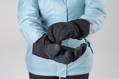 Person Wearing Black Thermal Winter Gloves and Jacket Person Wearing Black Thermal Winter Gloves and Jacket