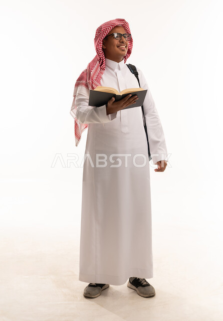 Saudi Male Student with Book and Backpack