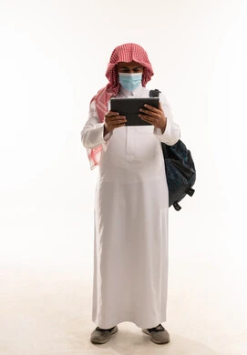 Saudi Man with Tablet and Face Mask Studio Shot