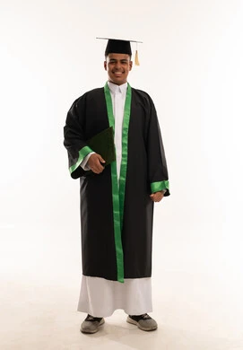 Smiling Saudi Male Student in Graduation Gown Isolated