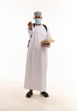 Omani Student with Books and Face Mask Pointing