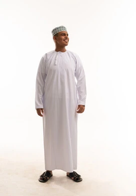 Omani Man in Traditional Dishdasha and Kumma Cap
