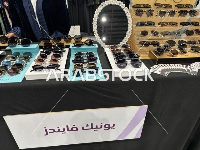 Diverse booths at the Designers' Exhibition in the Eastern Province on December 29, 2025, Saudi Arabia, a creative platform for fashion and design, direct interaction with visitors, highlighting identity and innovation, unique tasting experiences, and an elegant atmosphere inside the exhibition.