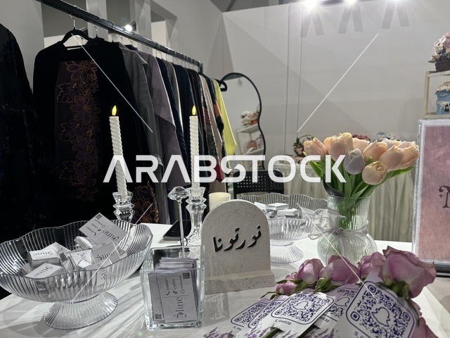 A creative platform for fashion and design, a designers' exhibition in the Eastern Province on December 29, 2025, Saudi Arabia, highlighting identity and innovation, unique tasting experiences, direct interaction with visitors, and an upscale atmosphere within the exhibition.