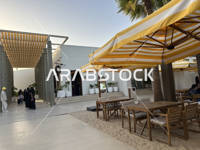 Arab women in traditional dress at Salt Al Bahr, a family-friendly beach and entertainment destination located on the Corniche Road in Al Khobar, Saudi Arabia. Further renovations and upgrades are scheduled for January 3, 2026. Pet-friendly.