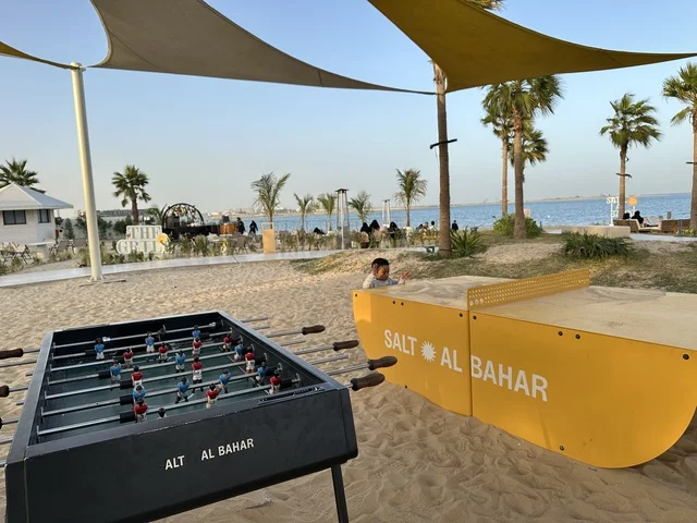 Sand foosball table and sandbox, Salt Al Bahar, a family-friendly beach and entertainment destination located on the Corniche Road in Al Khobar, Saudi Arabia, undergoes further renovations and upgrades on January 3, 2026, featuring a variety of activities including children's trampolines, paddleboarding, and table tennis.