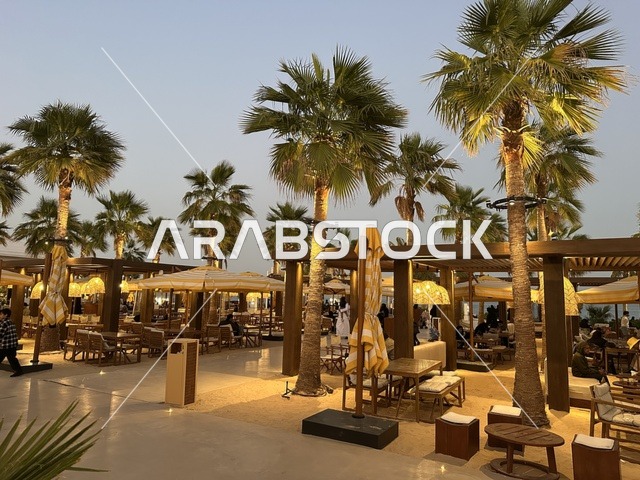 A sandy floor in the seating area, Solt Al-Bahr is a family-friendly recreational and beach destination located on the Corniche Road in Al Khobar, Saudi Arabia. Additional renovations and developments are set for January 3, 2026, featuring a sandy beach with umbrellas and palm trees.